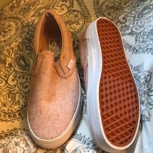 Purple flannel slipon vans.